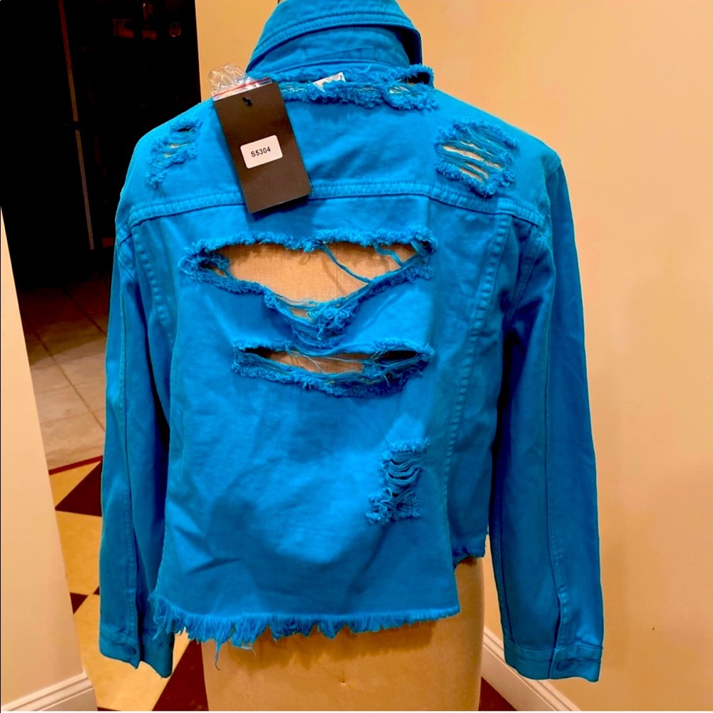 New with tags. Tattered denim jacket. Size small.